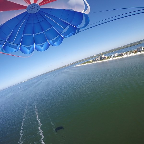 a large blue umbrella in the rain