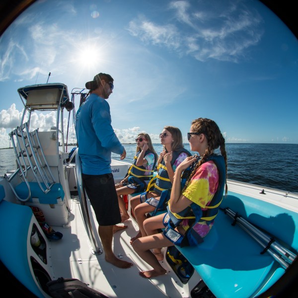 a person riding on the back of a boat